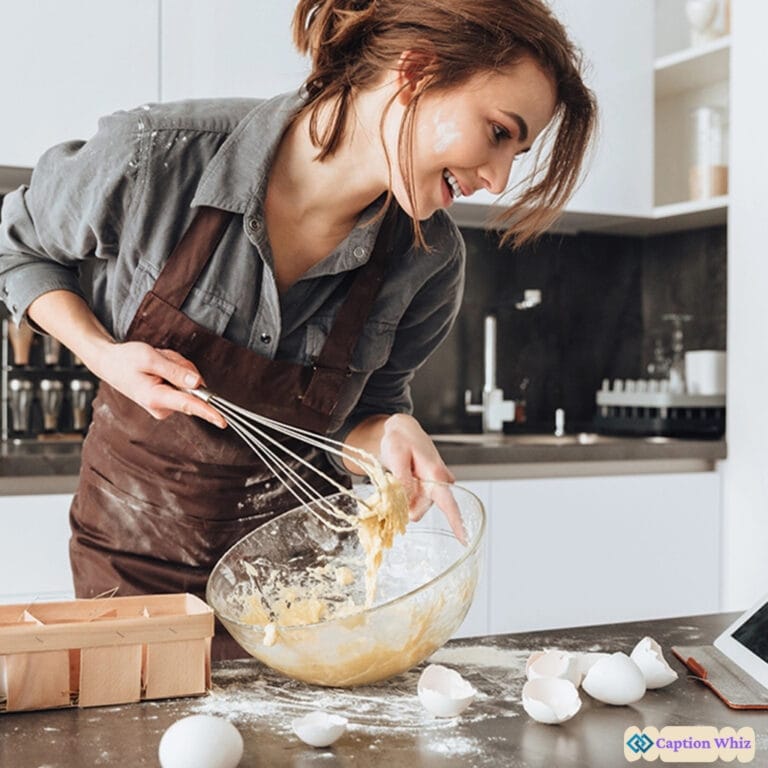 Woman happily mixing cake batter in a glass bowl, flour scattered around.